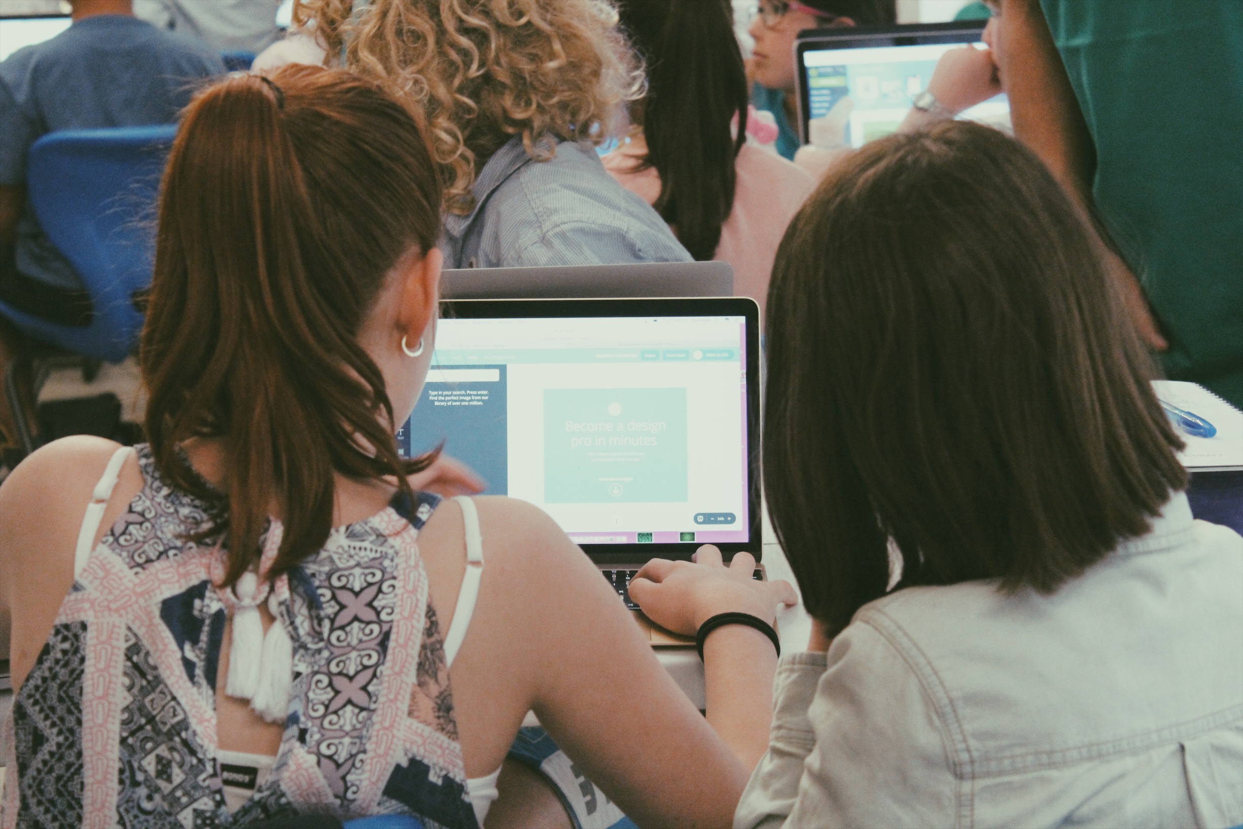 Lemonade Stand Workshop - two girls looking at a laptop screen