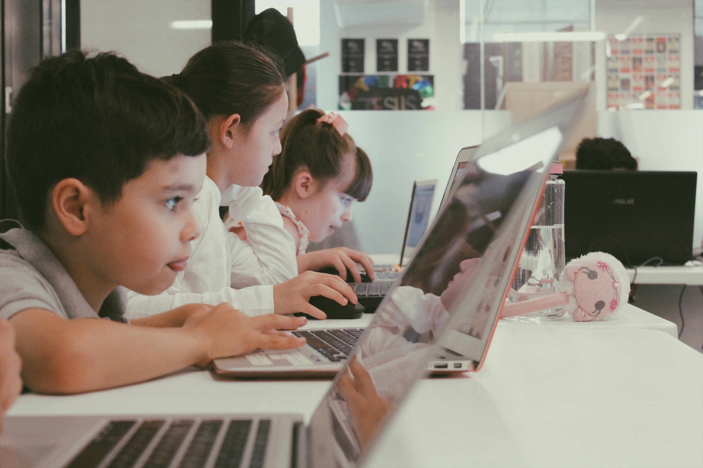 Lemonade Camp: two girls use Canva to build a slide deck